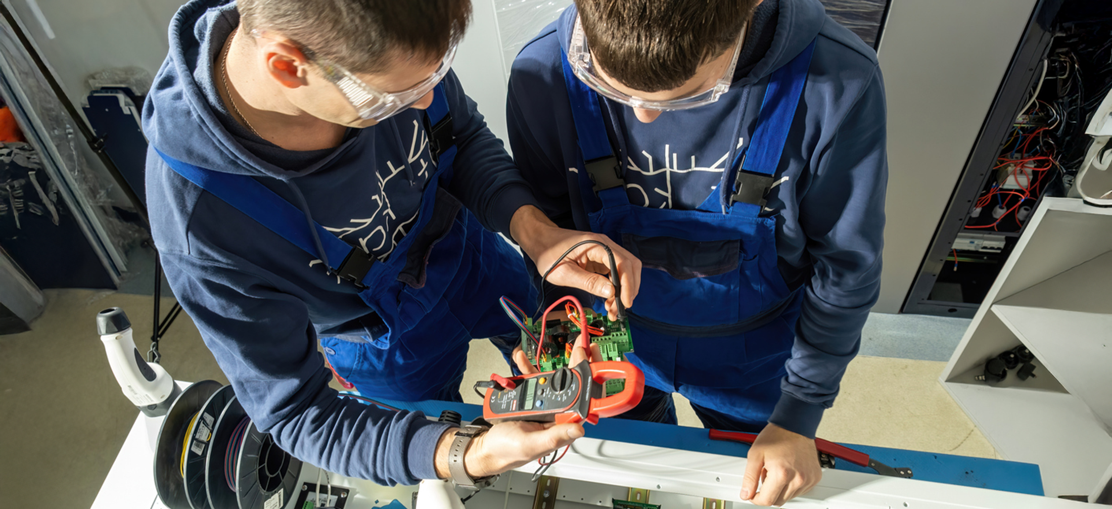 Students looking at a multimeter reading