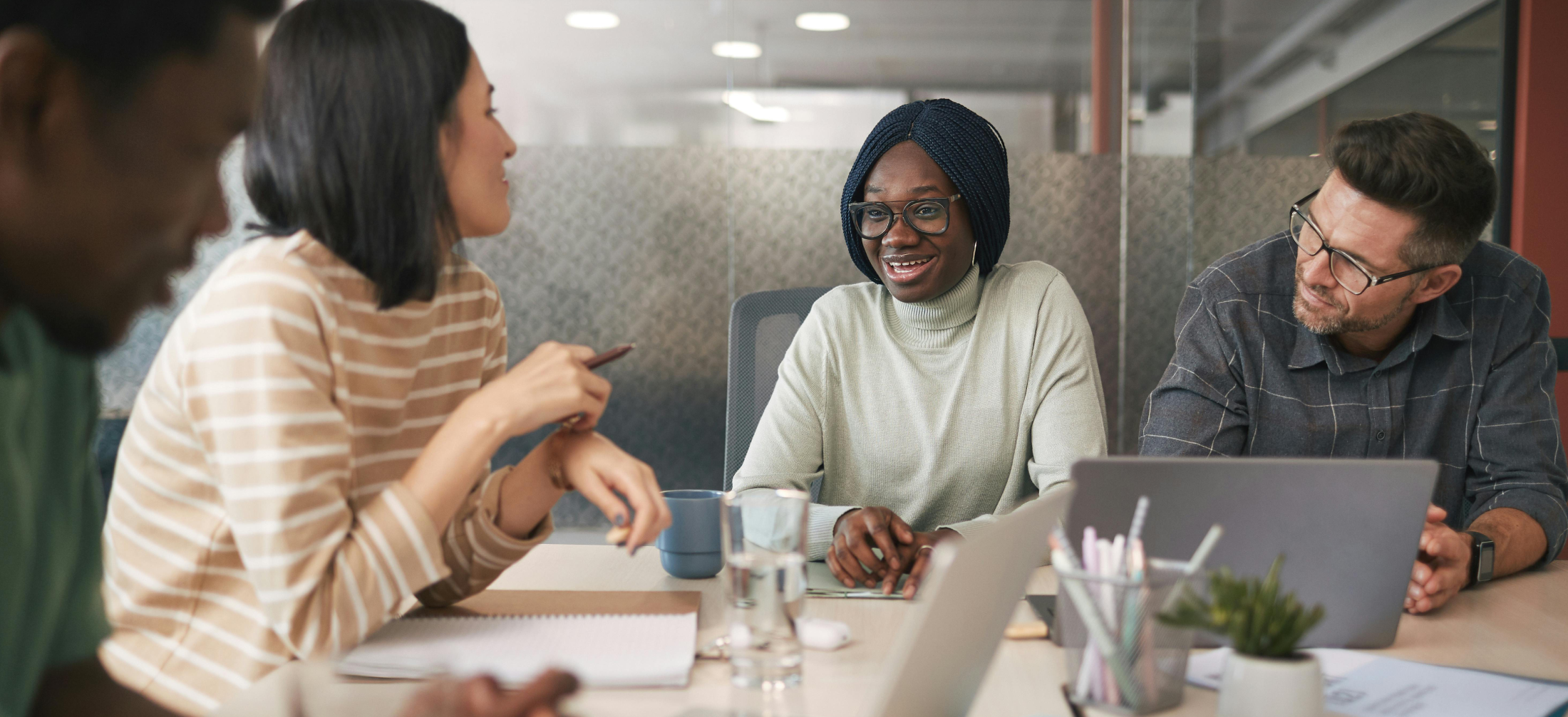 team conversing at tables