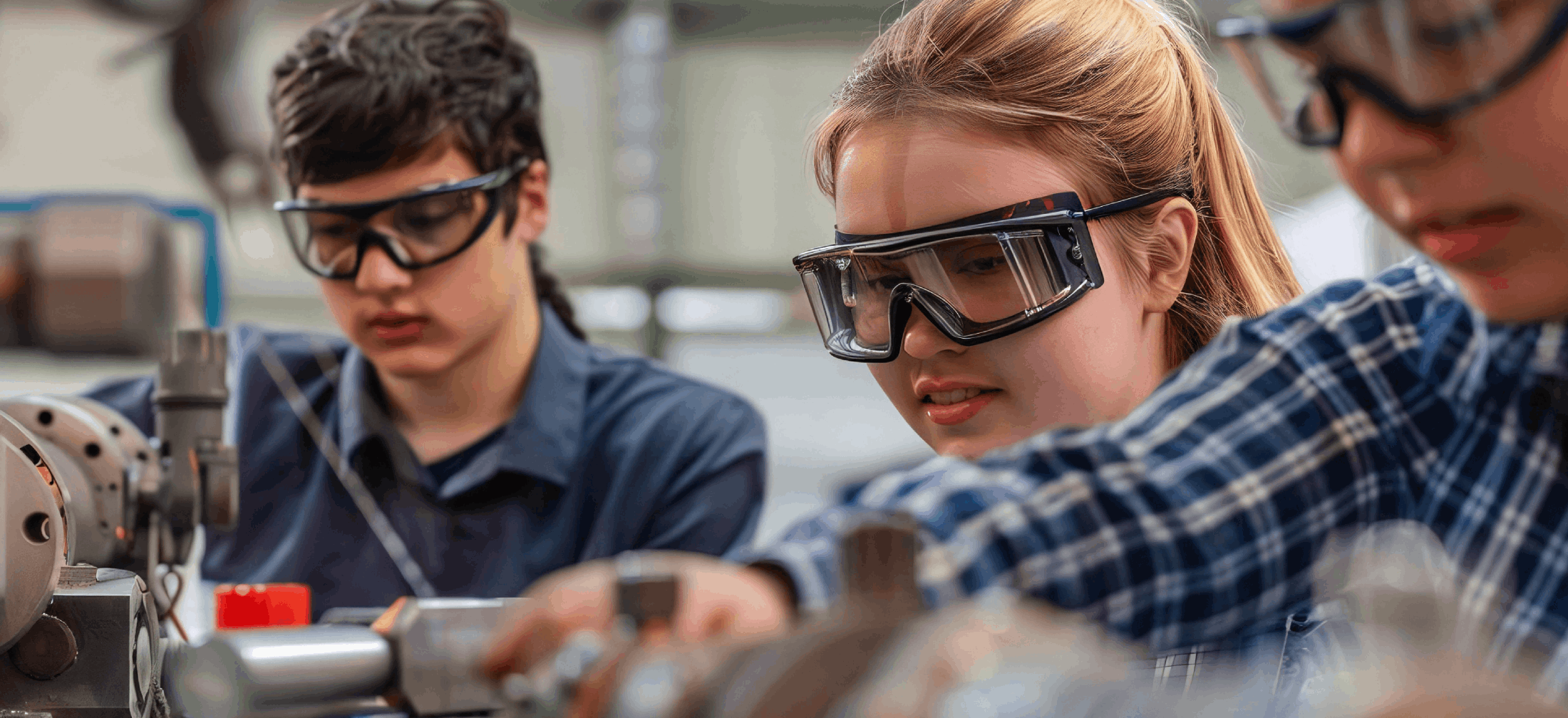 students in safety goggles working on project